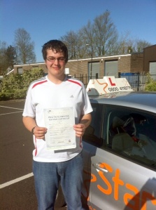 Craig with his Practical Driving Test Pass Certificate outside Weston-super-Mare Driving Test Centre