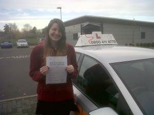 Lydia with her Practical Driving Test Pass Certificate outside Taunton Driving Test Centre