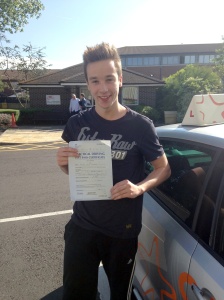 Joseph with his Pracitcal Driving Test Pass Certificate outside Weston-super-mare Driving Test Centre