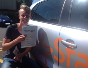 Nick with his Practical Driving Test Pass certificate outside Weston-super-Mare Driving Test Centre