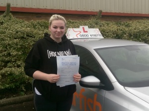 Gabbie with her Practical Driving Test Pass Certificate outside Weston-super-mare Driving Test Centre